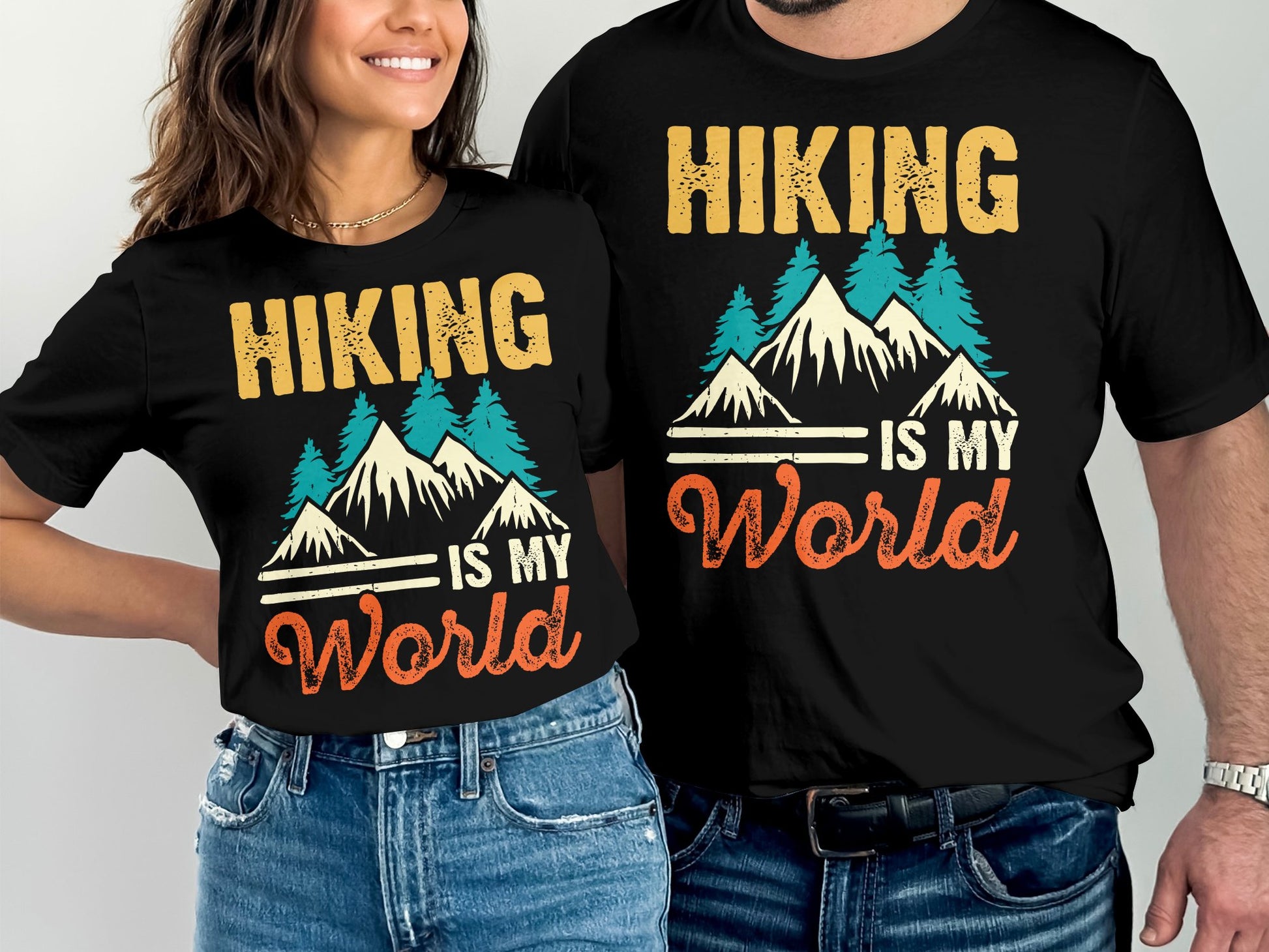 Two black t-shirts with "Hiking is My World" text and mountain graphic.