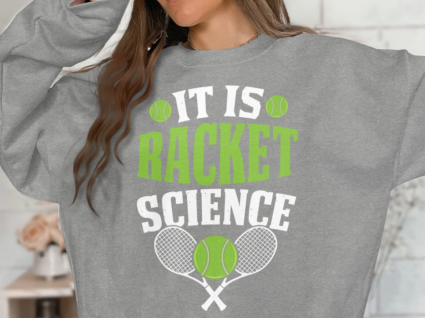 Gray sweatshirt with "IT IS RACKET SCIENCE" and tennis graphics.