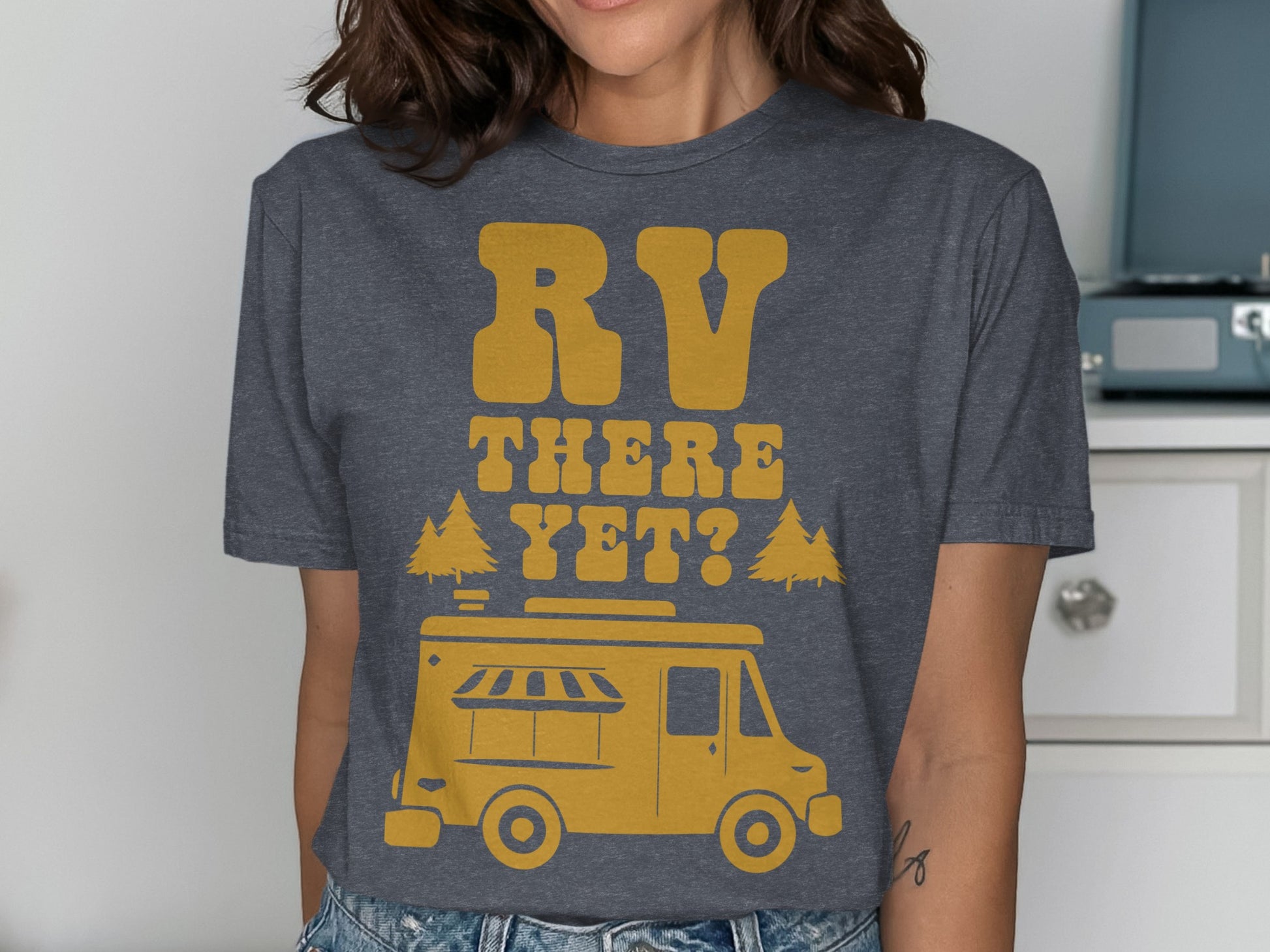 T-shirt with yellow RV and "RV THERE YET?" text and trees.