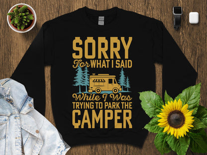 Black sweatshirt with text "Sorry while I was trying to park the camper".