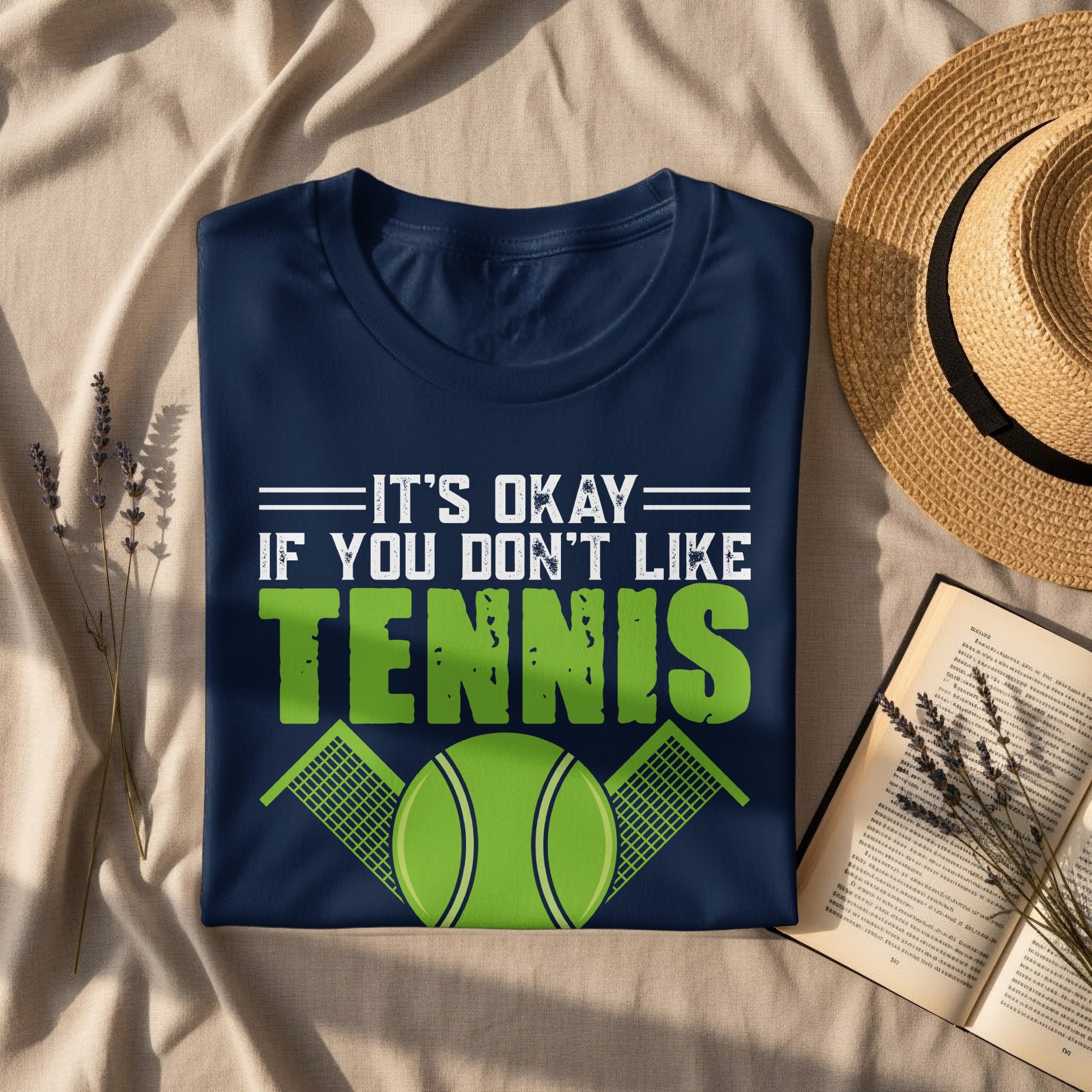 Navy t-shirt with text "IT'S OKAY IF YOU DON'T LIKE TENNIS" and a tennis ball graphic.