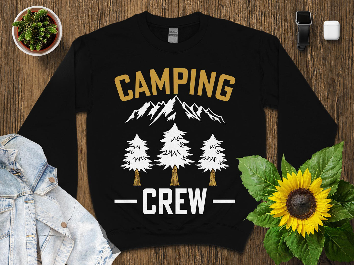 Black sweatshirt with "CAMPING CREW" text and mountain and tree graphics.
