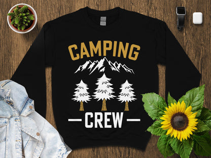Black sweatshirt with "CAMPING CREW" text and mountain and tree graphics.