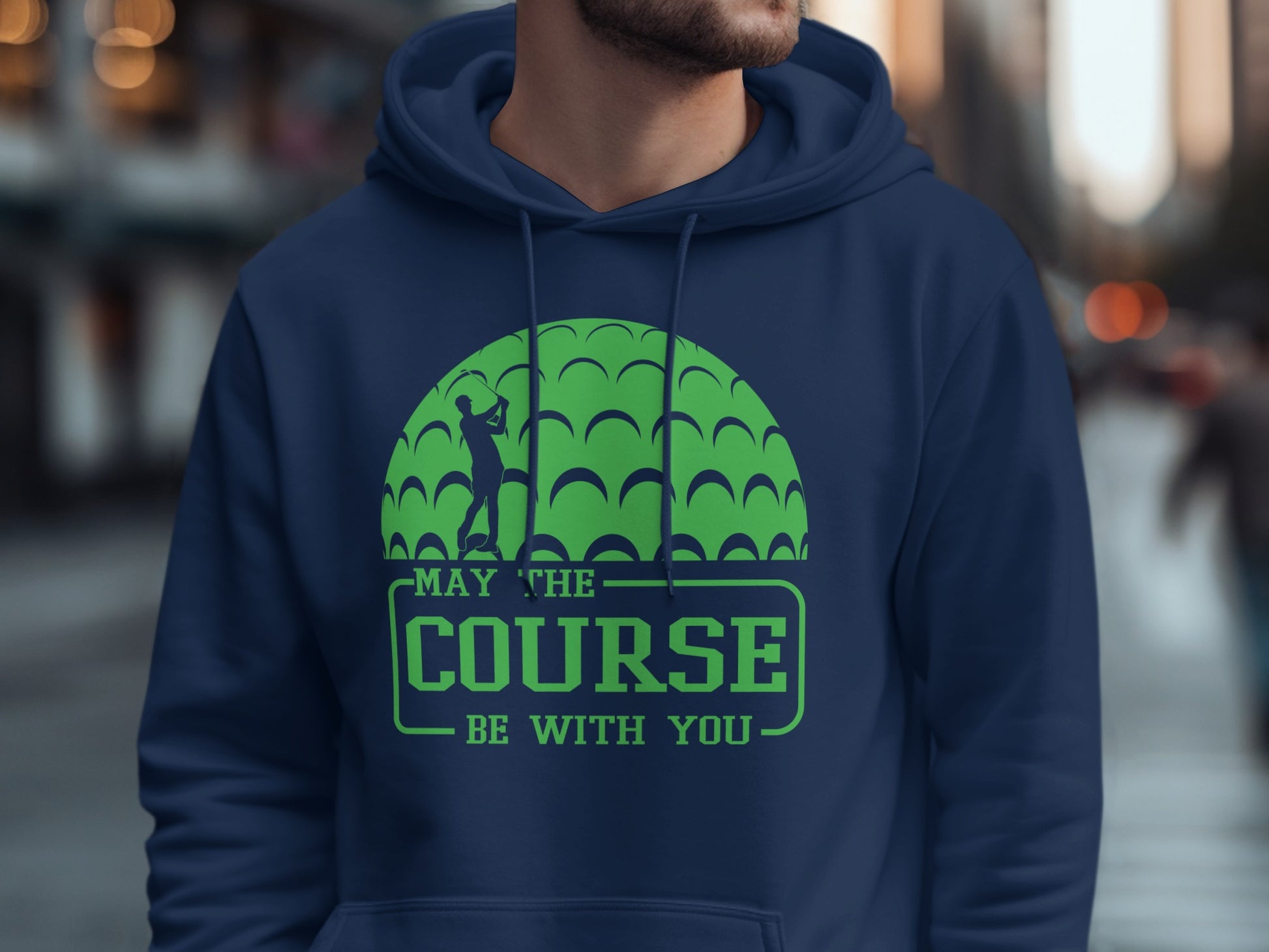 Green golf ball graphic with text "MAY THE COURSE BE WITH YOU".
