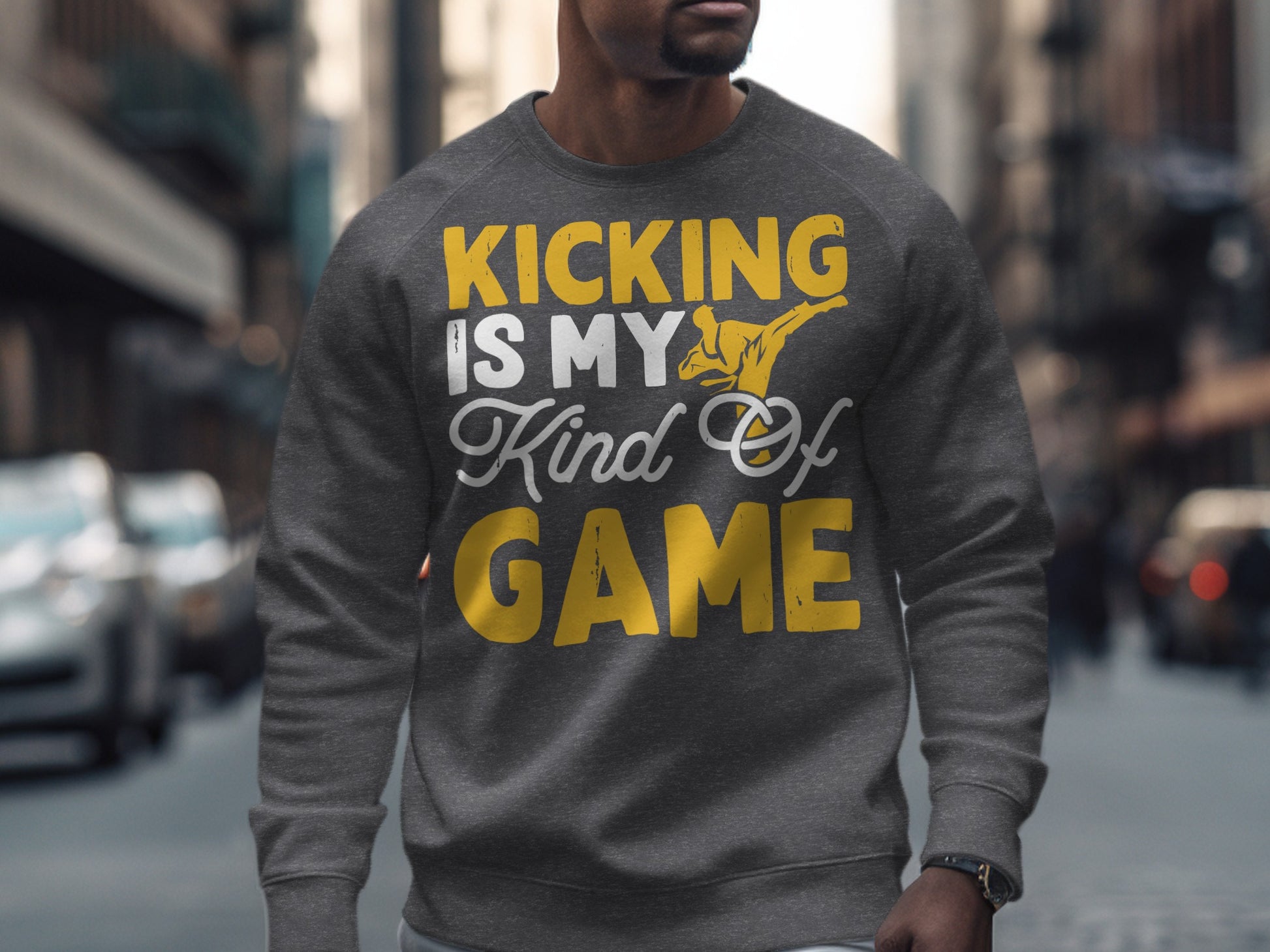 Gray sweatshirt with "Kicking is my kind of game" text and a kicking figure.