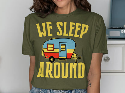 Green t-shirt with "We Sleep Around" text and cartoon camper.