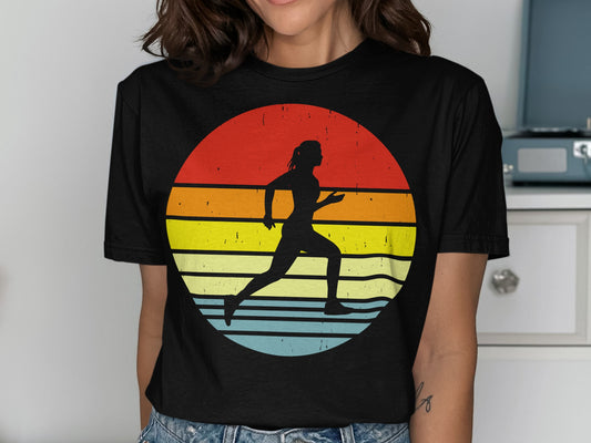 Silhouette of a runner against a circular sunset with red, yellow, and blue stripes.