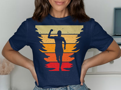 Runner silhouetted against a sunset gradient on a navy t-shirt.