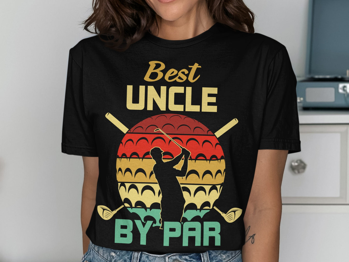 Black t-shirt with "Best Uncle By Par" text and golfer silhouette graphic.