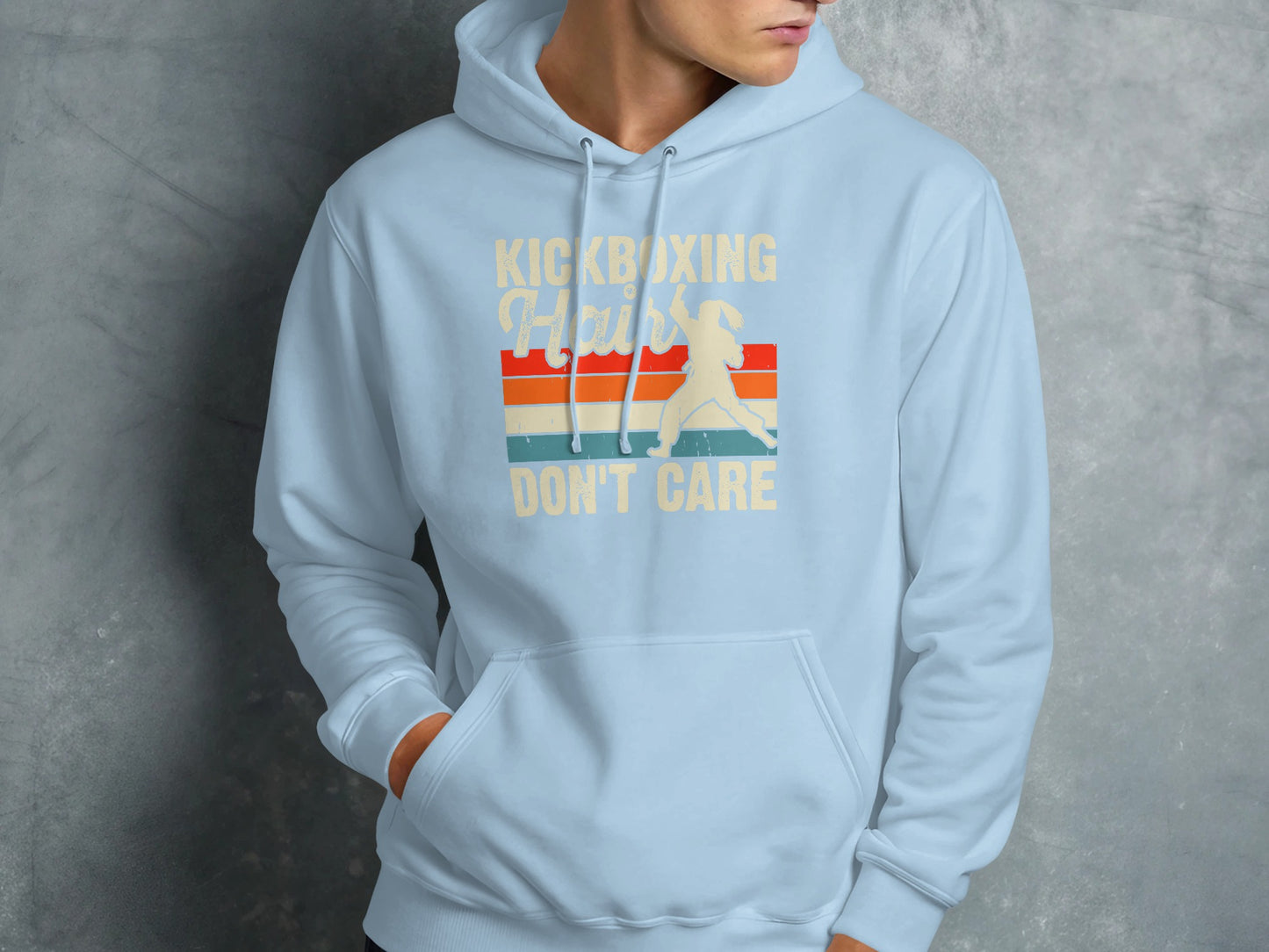 Light blue hoodie with "Kickboxing Hair Don't Care" text and fighter graphic.