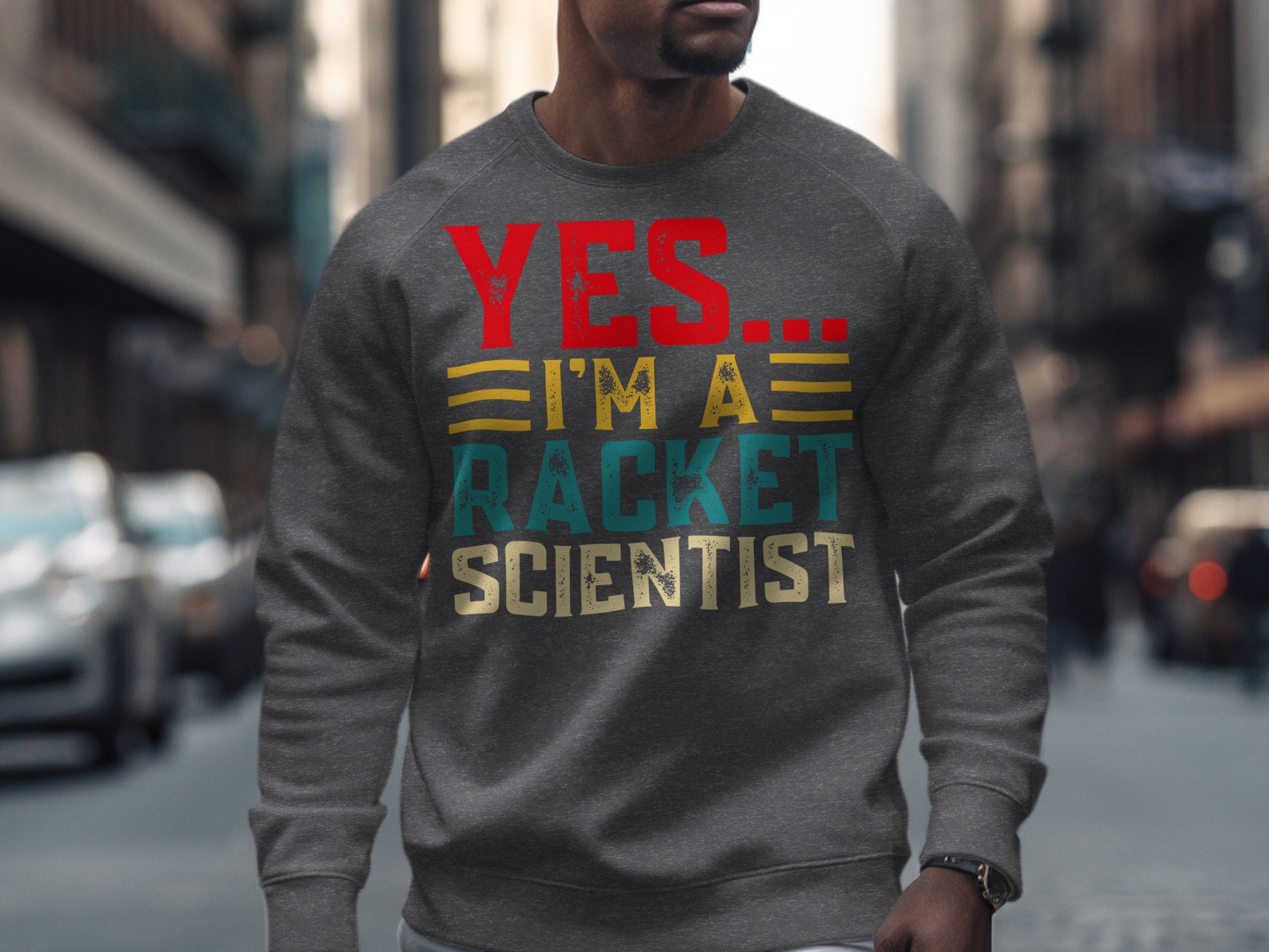 Gray sweatshirt with "YES... I'M A RACKET SCIENTIST" text.