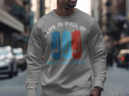 Gray sweatshirt with "Life is Full of Important Choices" text and golf club graphics.