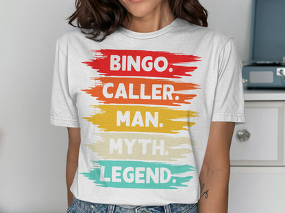 White t-shirt with "Bingo. Caller. Man. Myth. Legend." text in colorful brushstrokes.