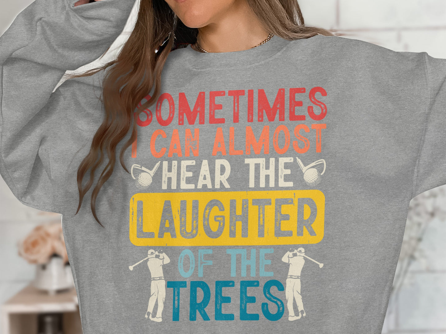 Grey sweatshirt with "Sometimes I can almost hear the laughter of the trees" text.