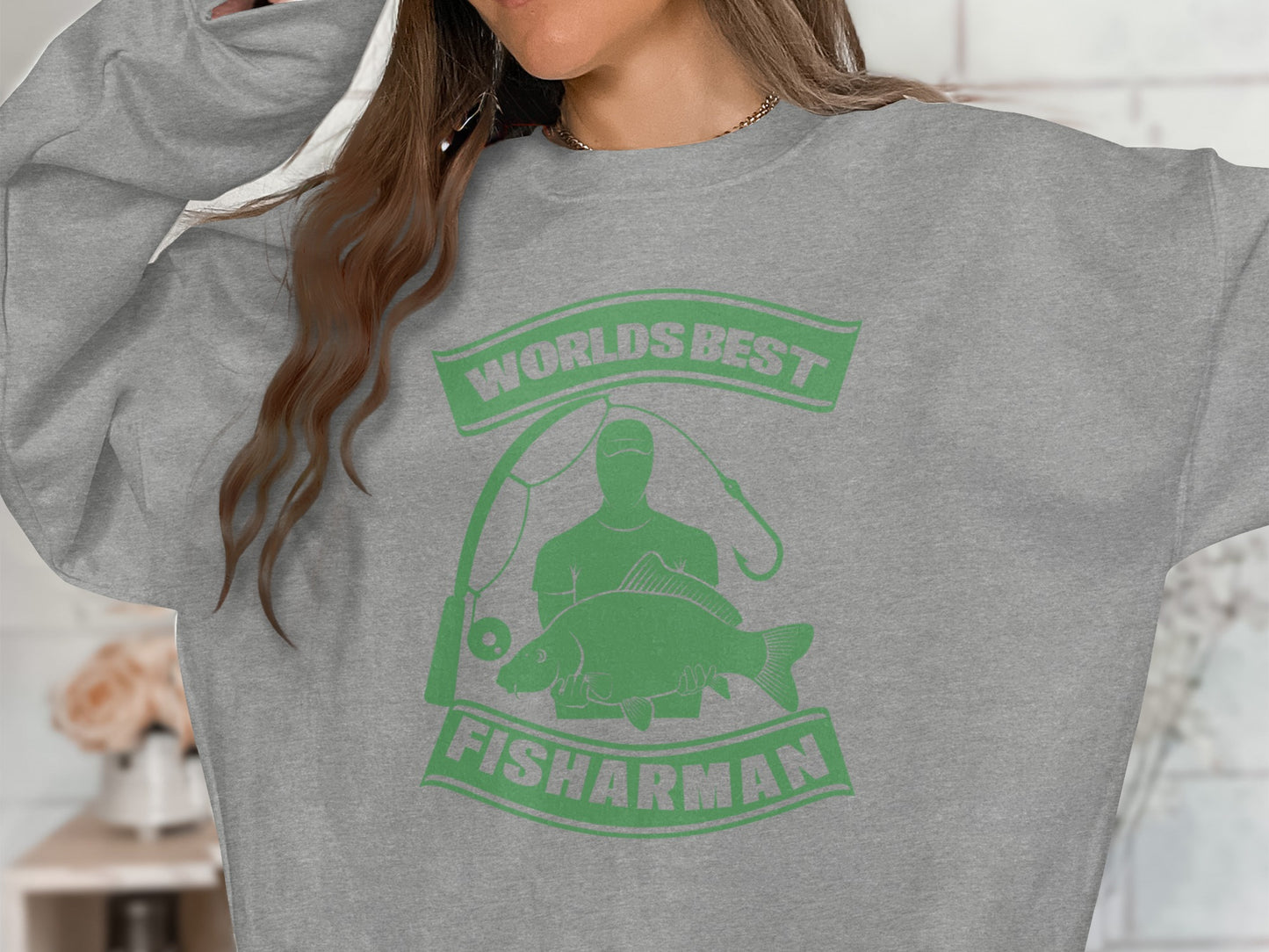 Grey sweatshirt with "WORLD'S BEST FISHARMAN" text and fish graphic.