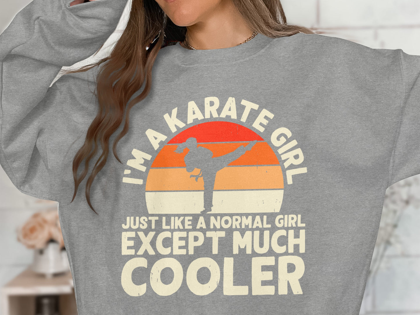 Gray sweatshirt with "I'M A KARATE GIRL JUST LIKE A NORMAL GIRL EXCEPT MUCH COOLER" graphic.