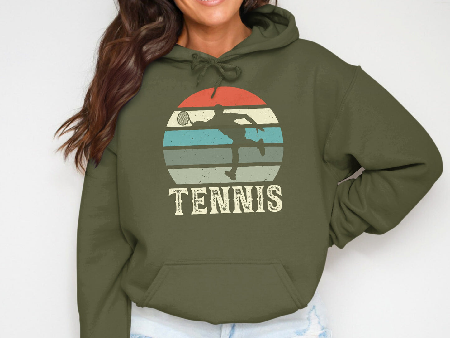 Olive hoodie with tennis player silhouette and striped sunset graphic.