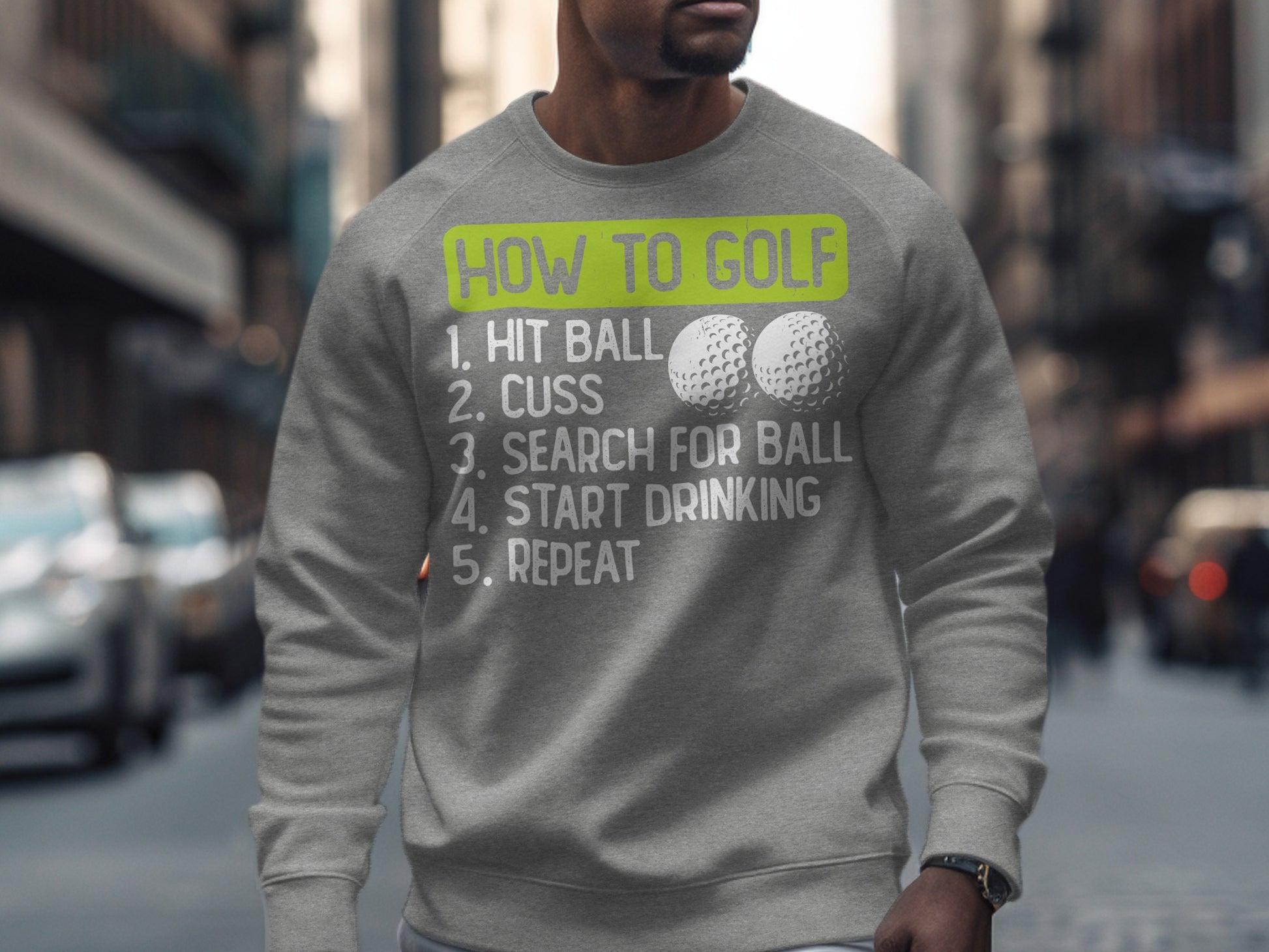Gray sweatshirt with "How to Golf" list: hit ball, cuss, search for ball, drink, repeat.