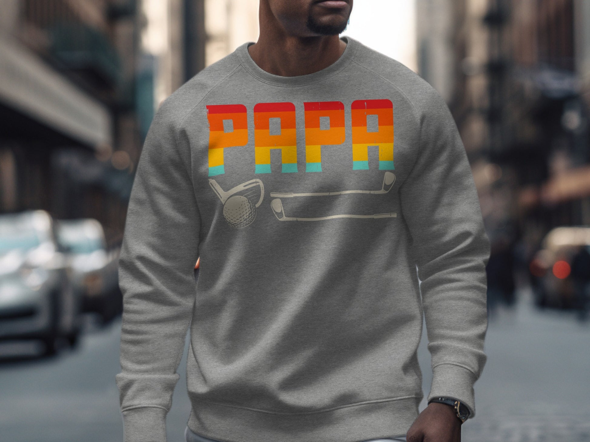 Grey sweatshirt with "PAPA" in colorful stripes and golf club graphic.