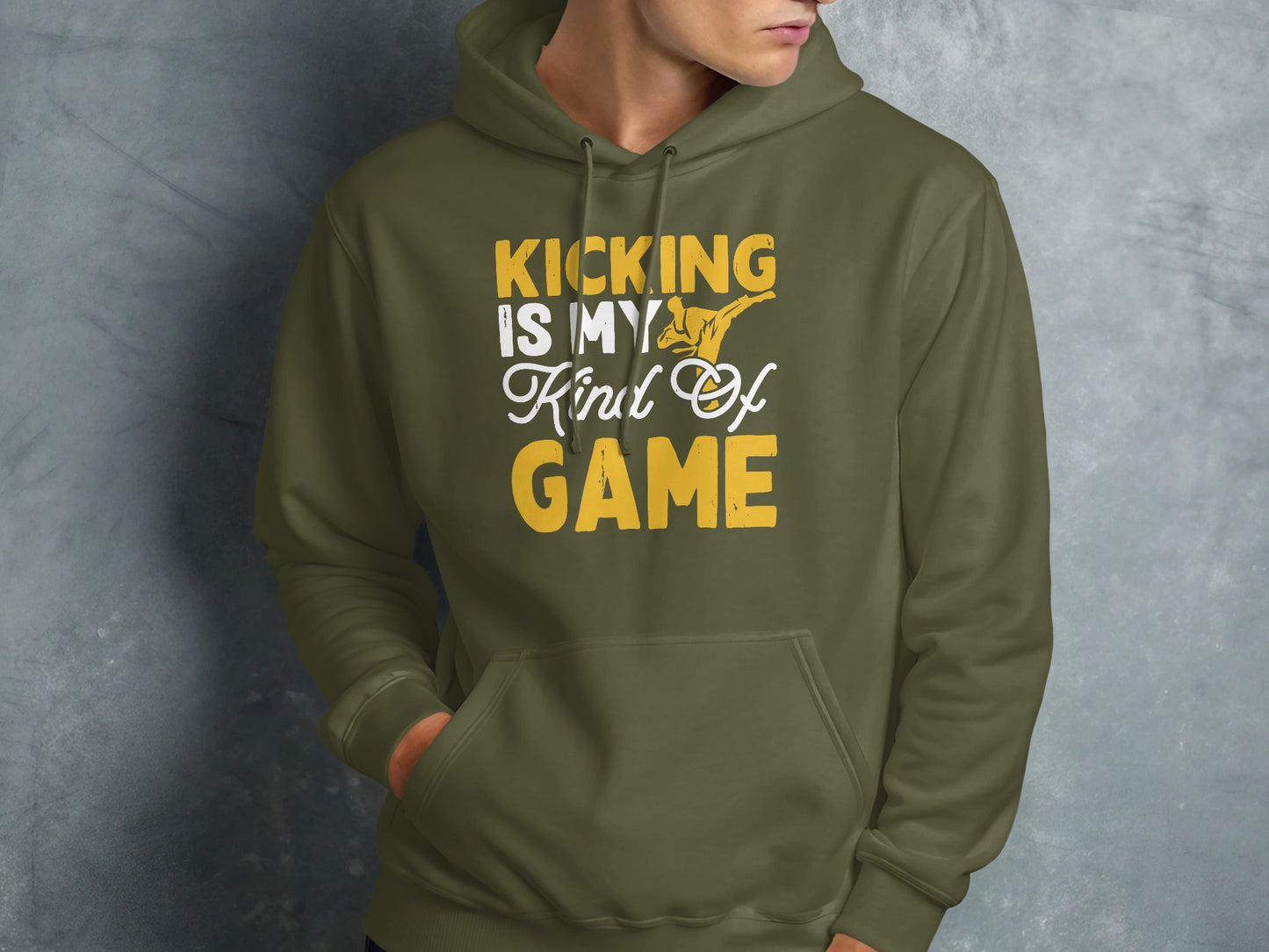 Green hoodie with "Kicking is my kind of game" text and karate silhouette.
