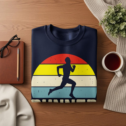 Navy sweatshirt with a runner silhouette against a vintage sunset graphic.