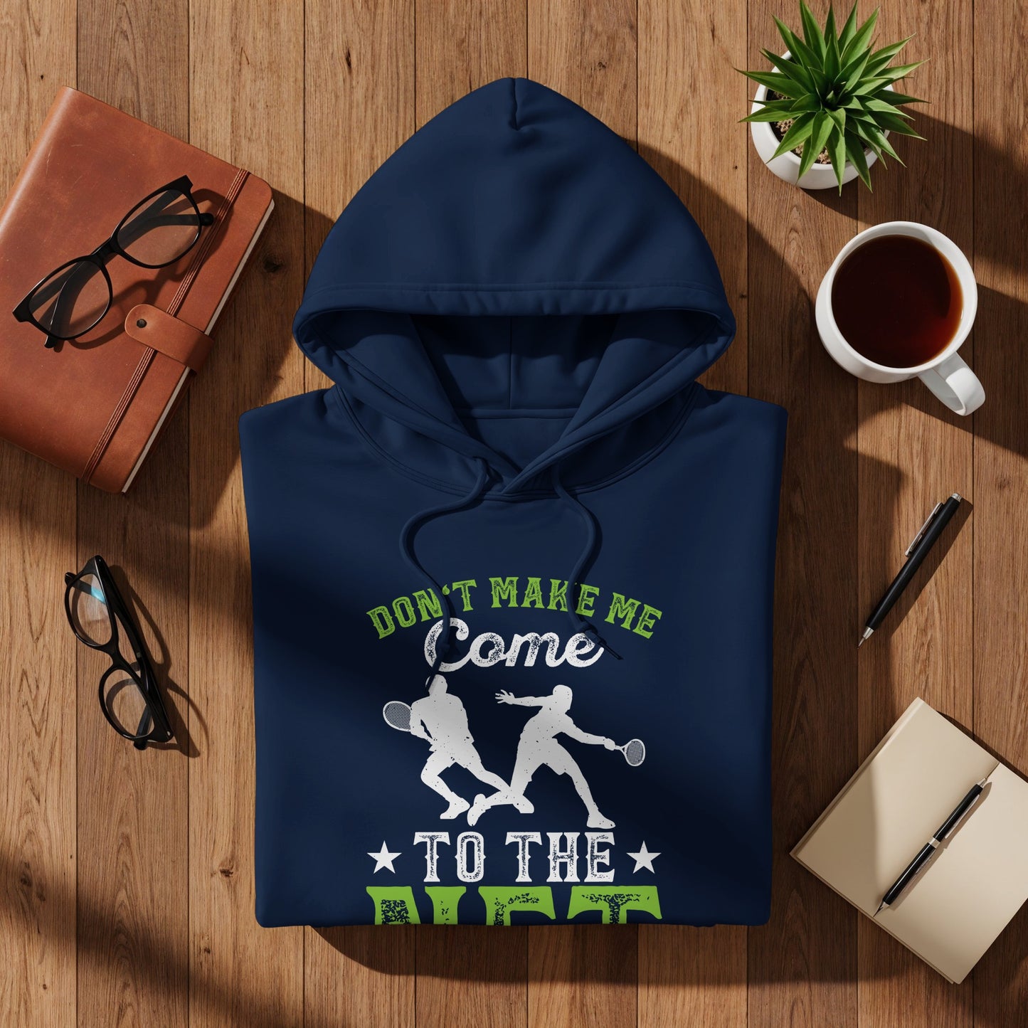 Navy hoodie with two tennis players and "DON'T MAKE ME COME TO THE COURT" text.