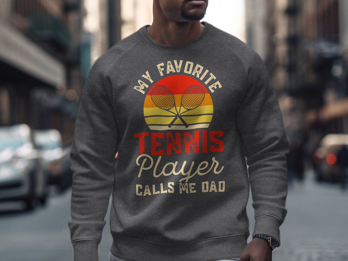 Men's crewneck sweatshirt with "My Favorite Tennis Player Calls Me Dad" graphic.