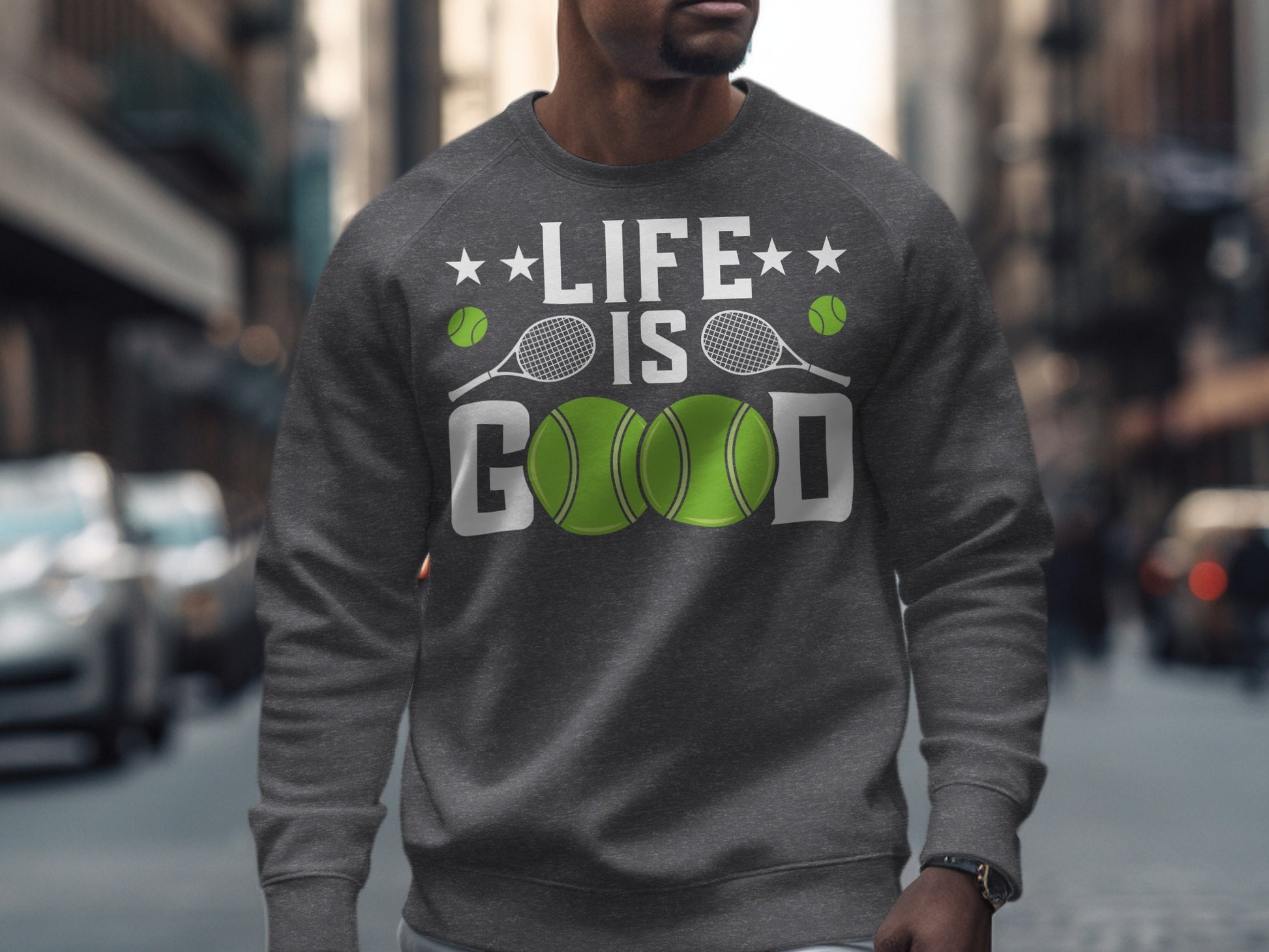 Gray sweatshirt with "Life is Good" and tennis balls graphic.