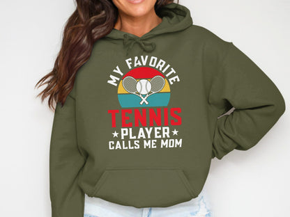 Olive hoodie with "My Favorite Tennis Player Calls Me Mom" text and crossed racquets.