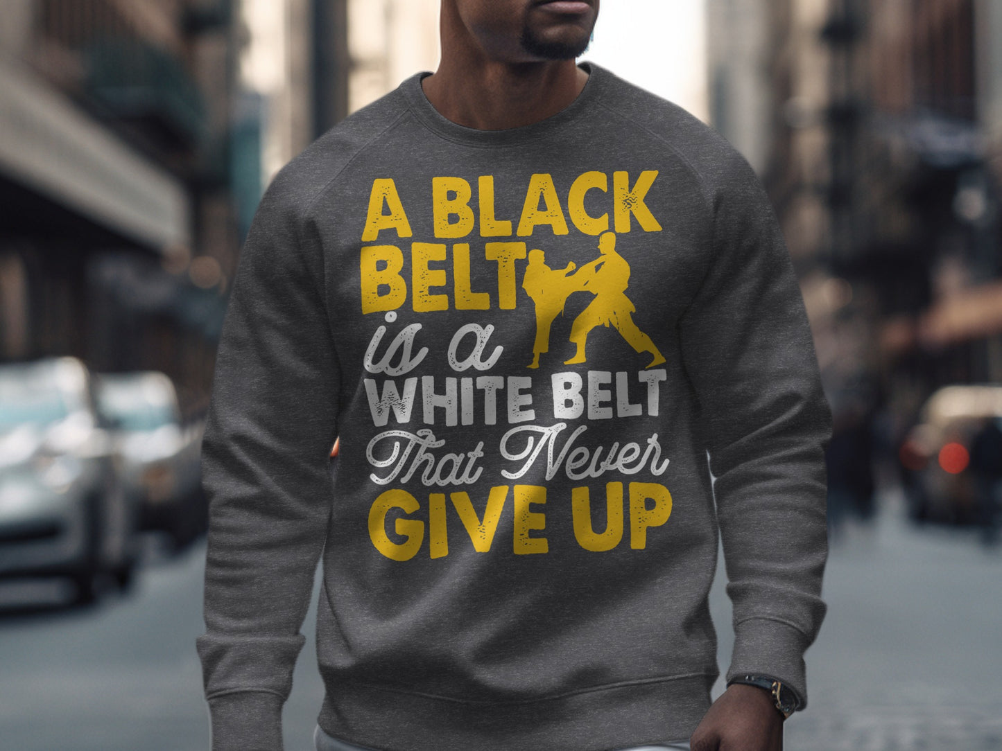 Grey sweatshirt with yellow text and silhouettes of two karate fighters.