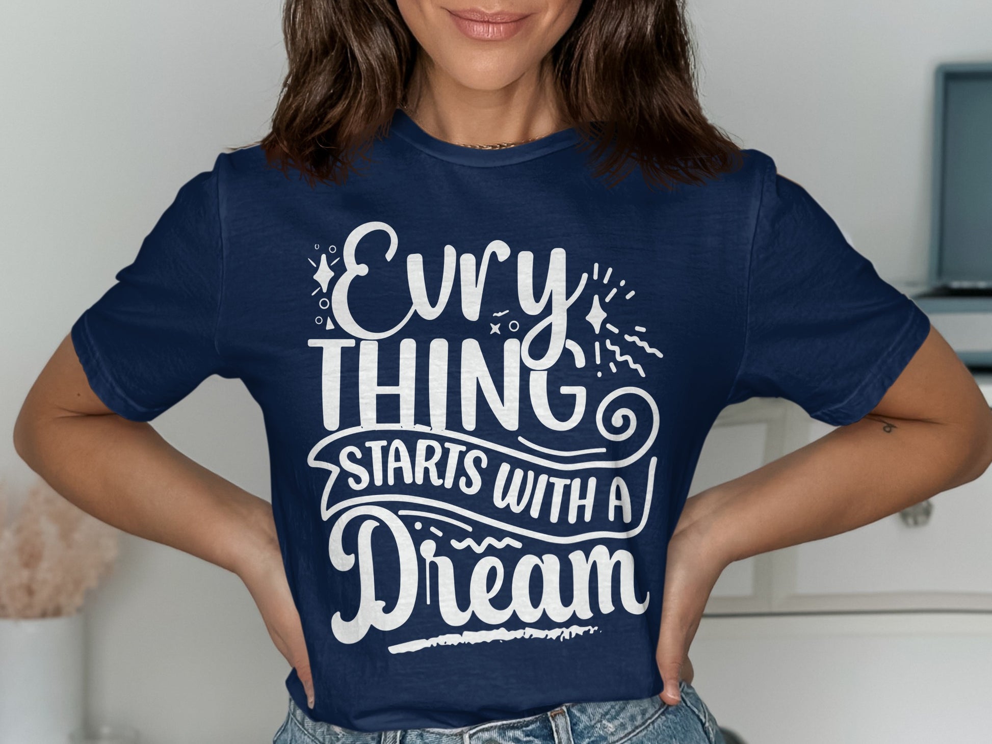 Navy t-shirt with "Everything Starts With A Dream" text in white.