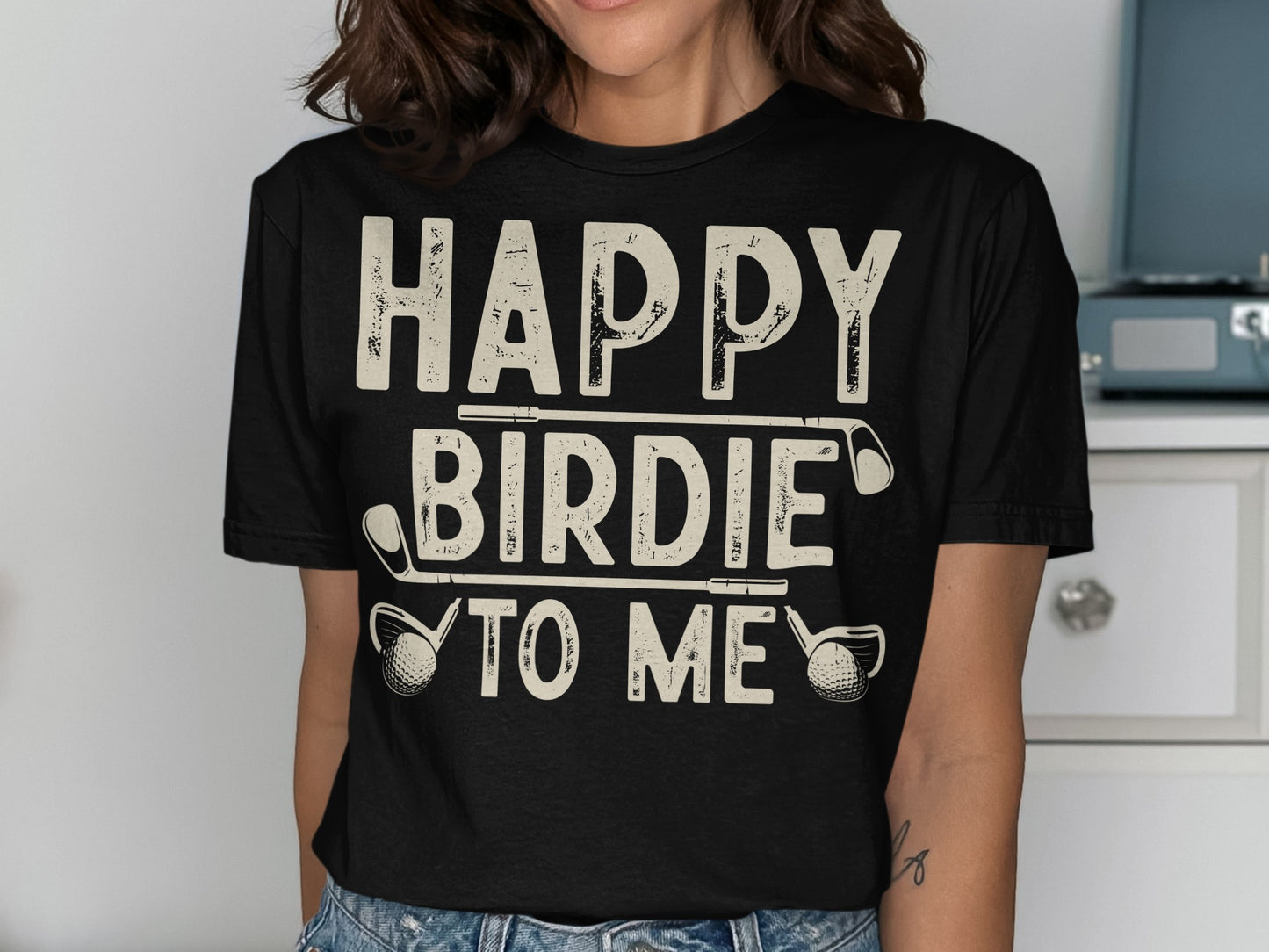 Black t-shirt with "HAPPY BIRDIE TO ME" text and golf clubs.