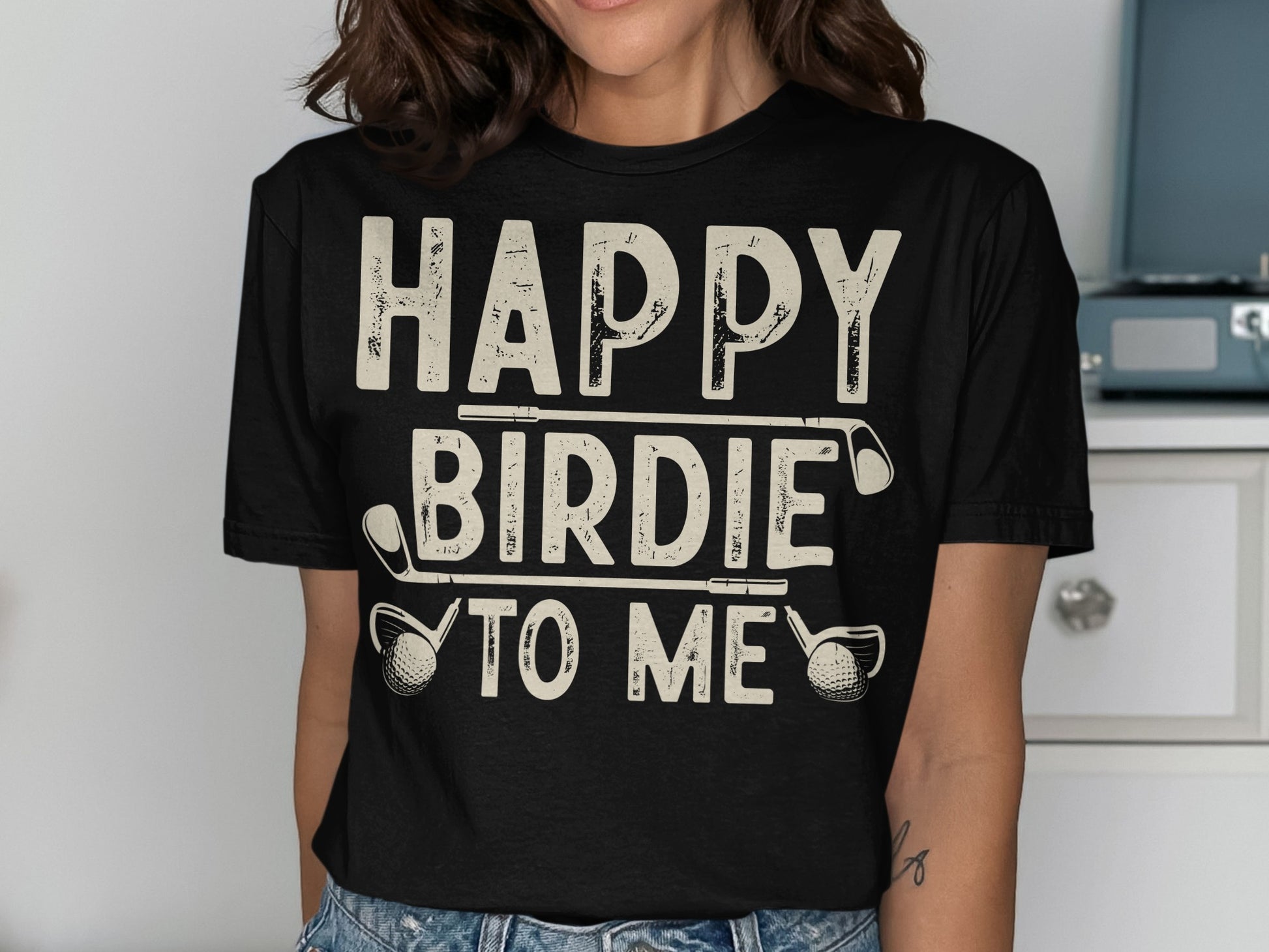 Black t-shirt with "HAPPY BIRDIE TO ME" text and golf clubs.