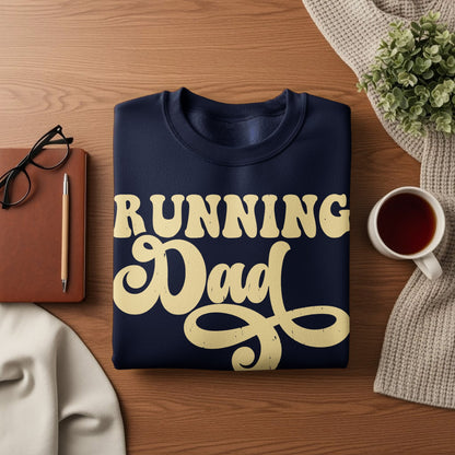 Navy sweatshirt with cream "Running Dad" text on a wooden surface.