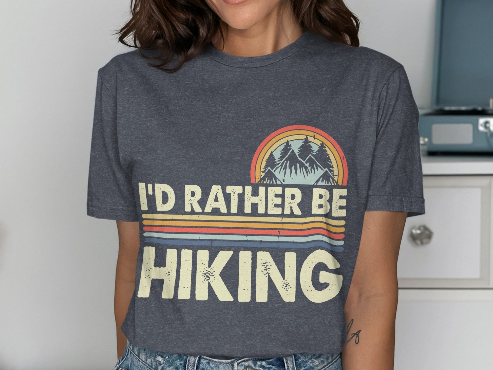 T-shirt with "I'D RATHER BE HIKING" text and mountain graphic.