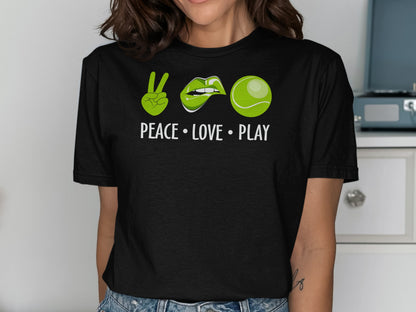 Black t-shirt with peace sign, lips, and tennis ball graphic and text.