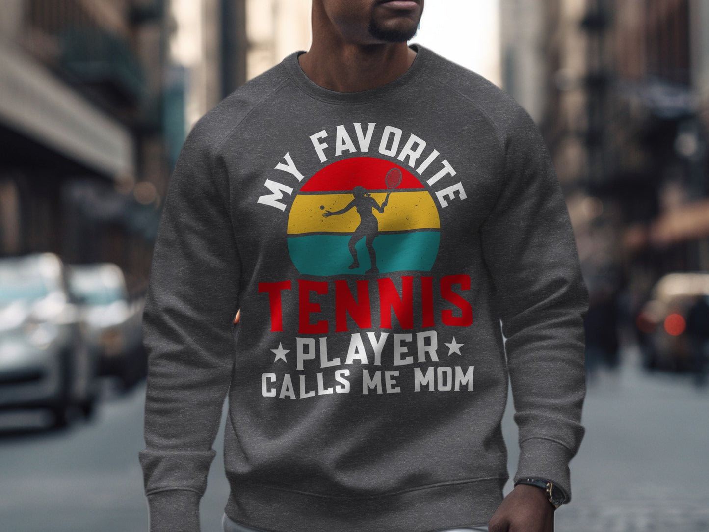 Sweatshirt with "My Favorite Tennis Player Calls Me Mom" graphic.