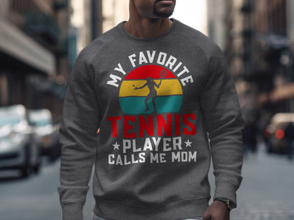 Sweatshirt with "My Favorite Tennis Player Calls Me Mom" graphic.