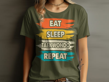 Green t-shirt with "Eat Sleep Taekwondo Repeat" text in colorful brushstrokes.