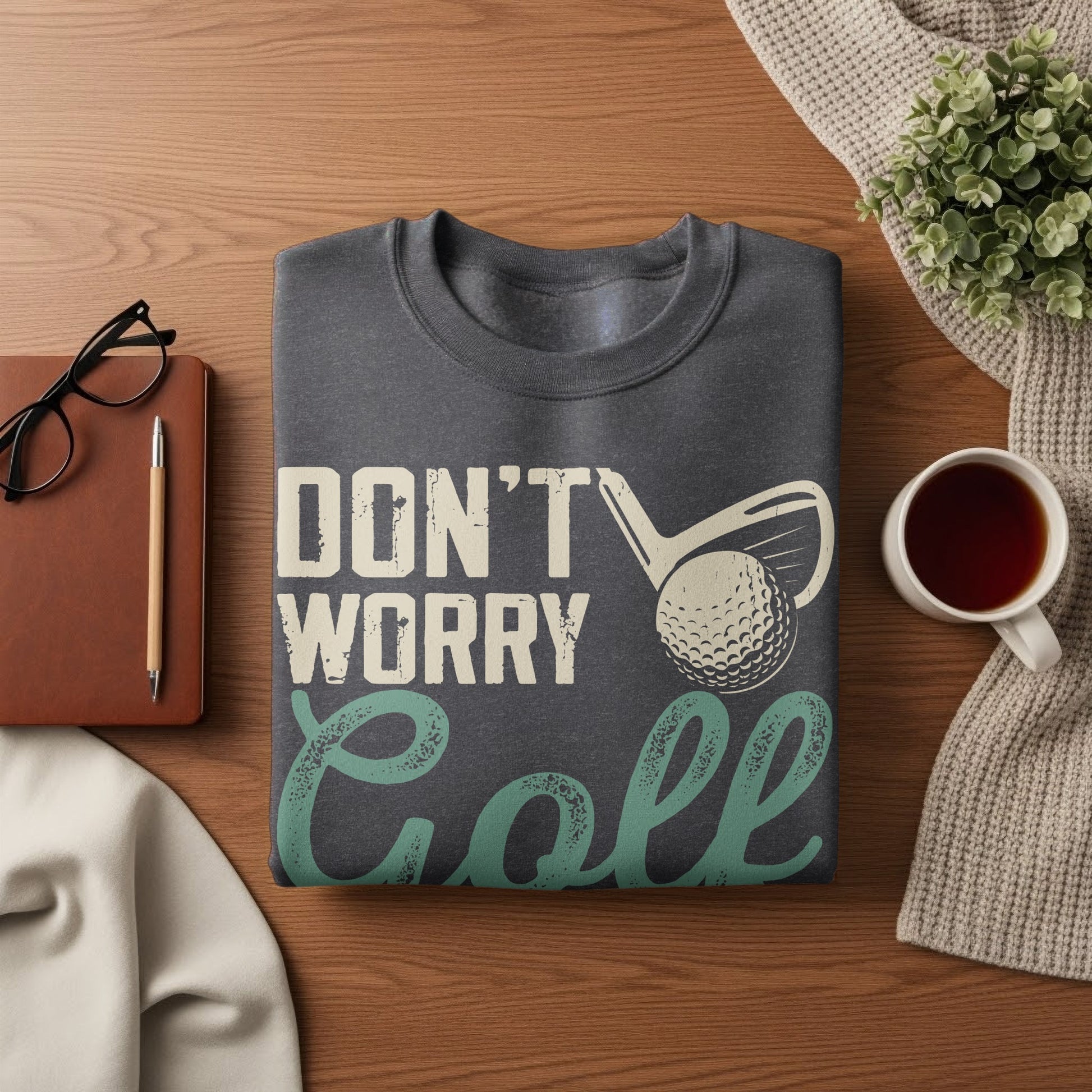 Dark gray sweatshirt with "DON'T WORRY GOLF" text and golf ball graphic.