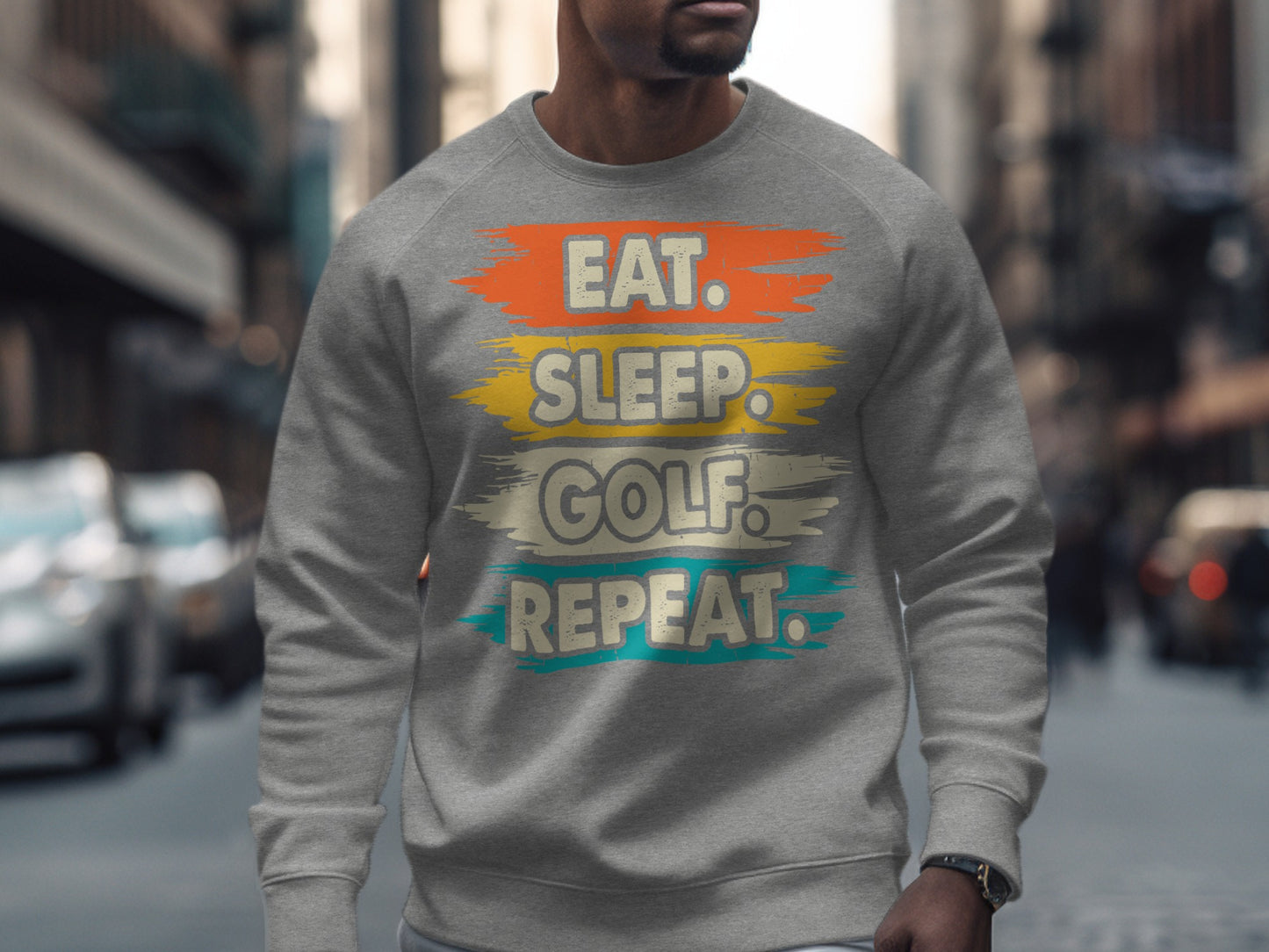 Gray sweatshirt with "Eat. Sleep. Golf. Repeat." text in brushstrokes.