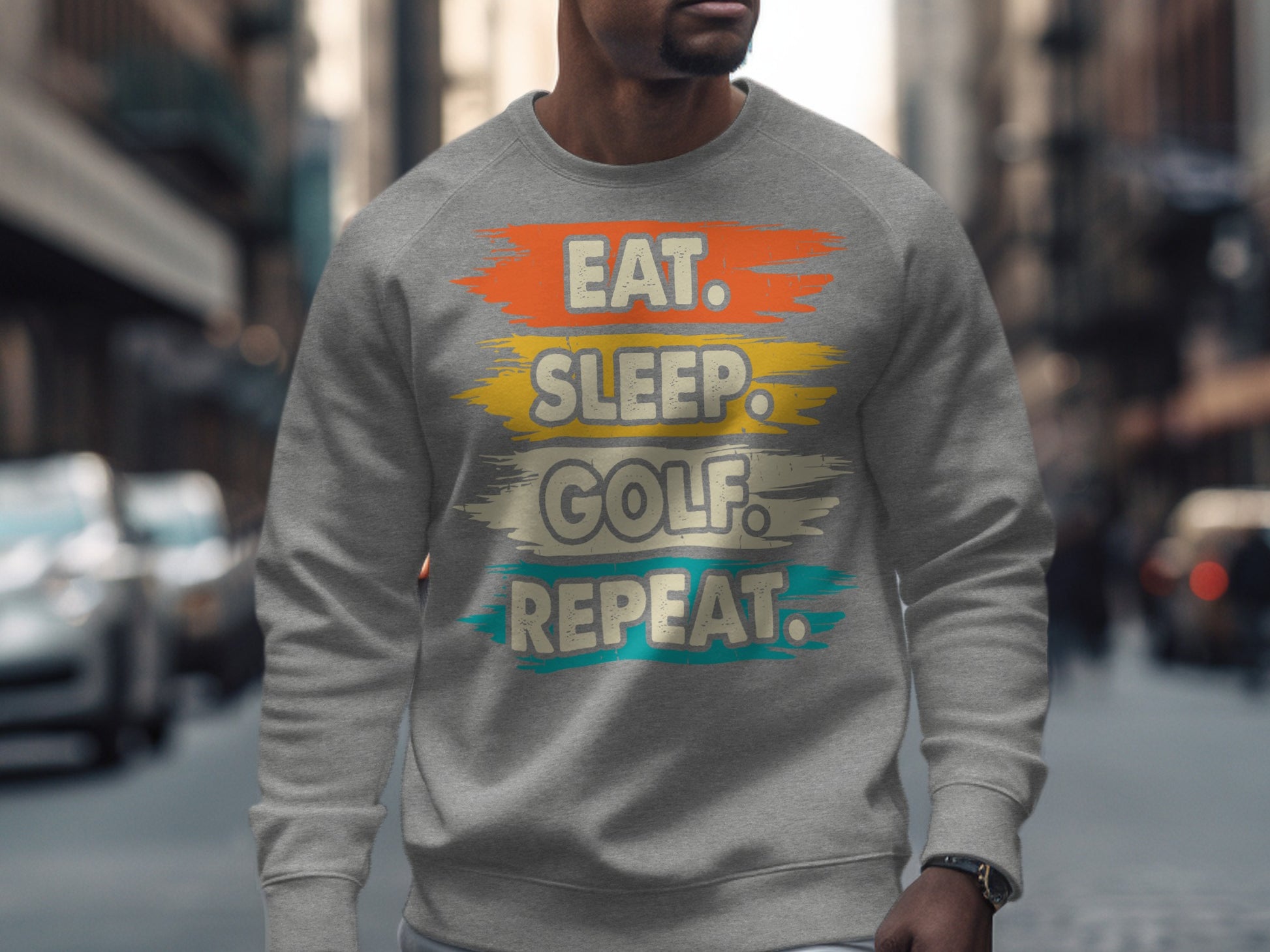 Gray sweatshirt with "Eat. Sleep. Golf. Repeat." text in brushstrokes.