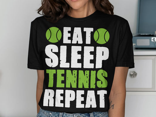 Black t-shirt with white "EAT SLEEP TENNIS REPEAT" and green tennis balls.