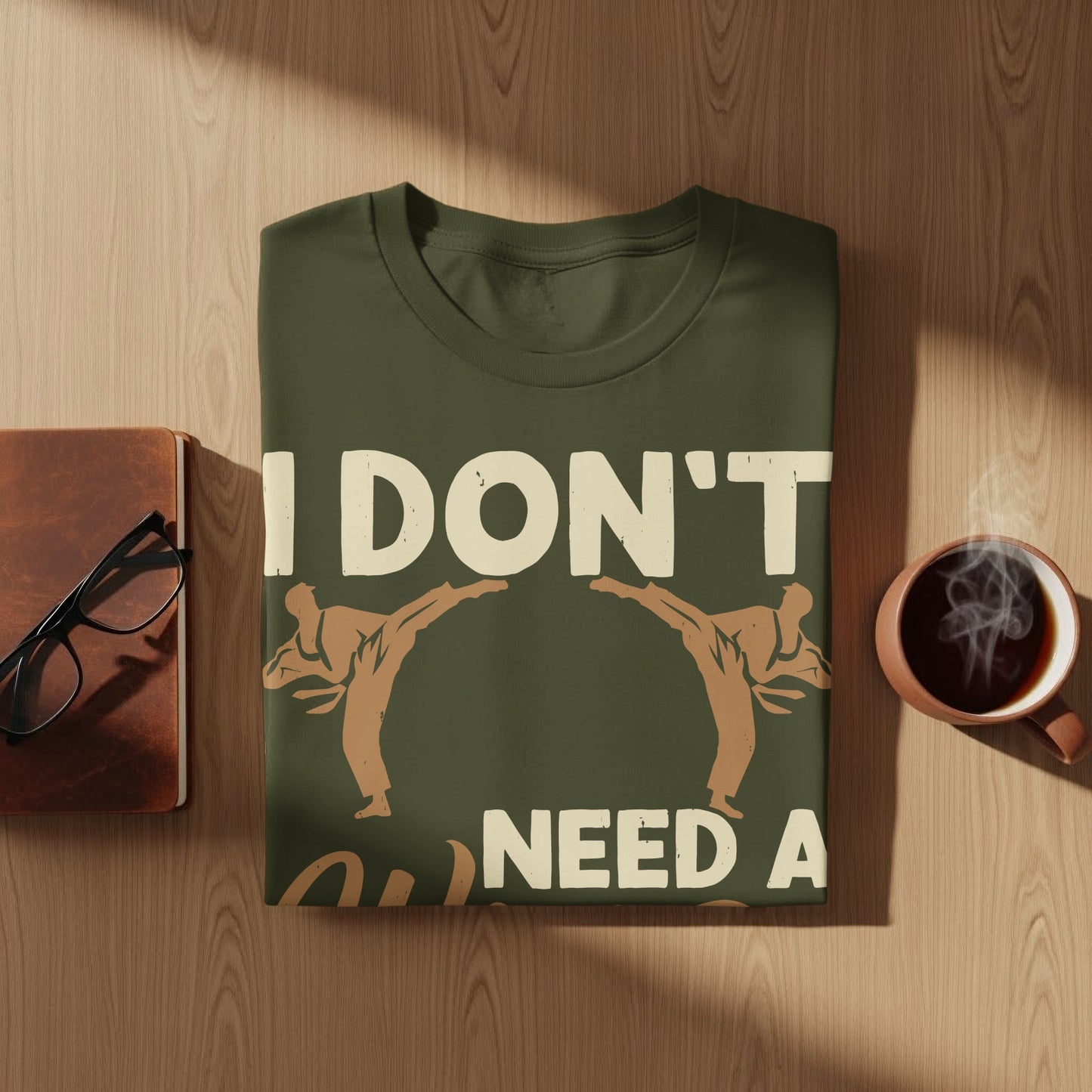 Olive green t-shirt with "I DON'T NEED A" and martial artists design.