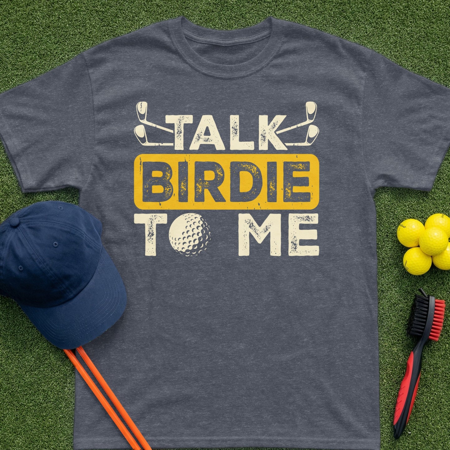 Dark t-shirt with "TALK BIRDIE TO ME" text and golf imagery.