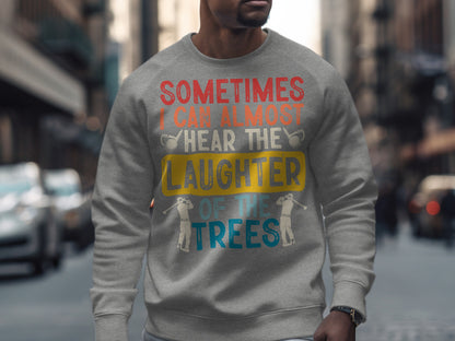 Gray sweatshirt with text "Sometimes I can almost hear the laughter of the trees."