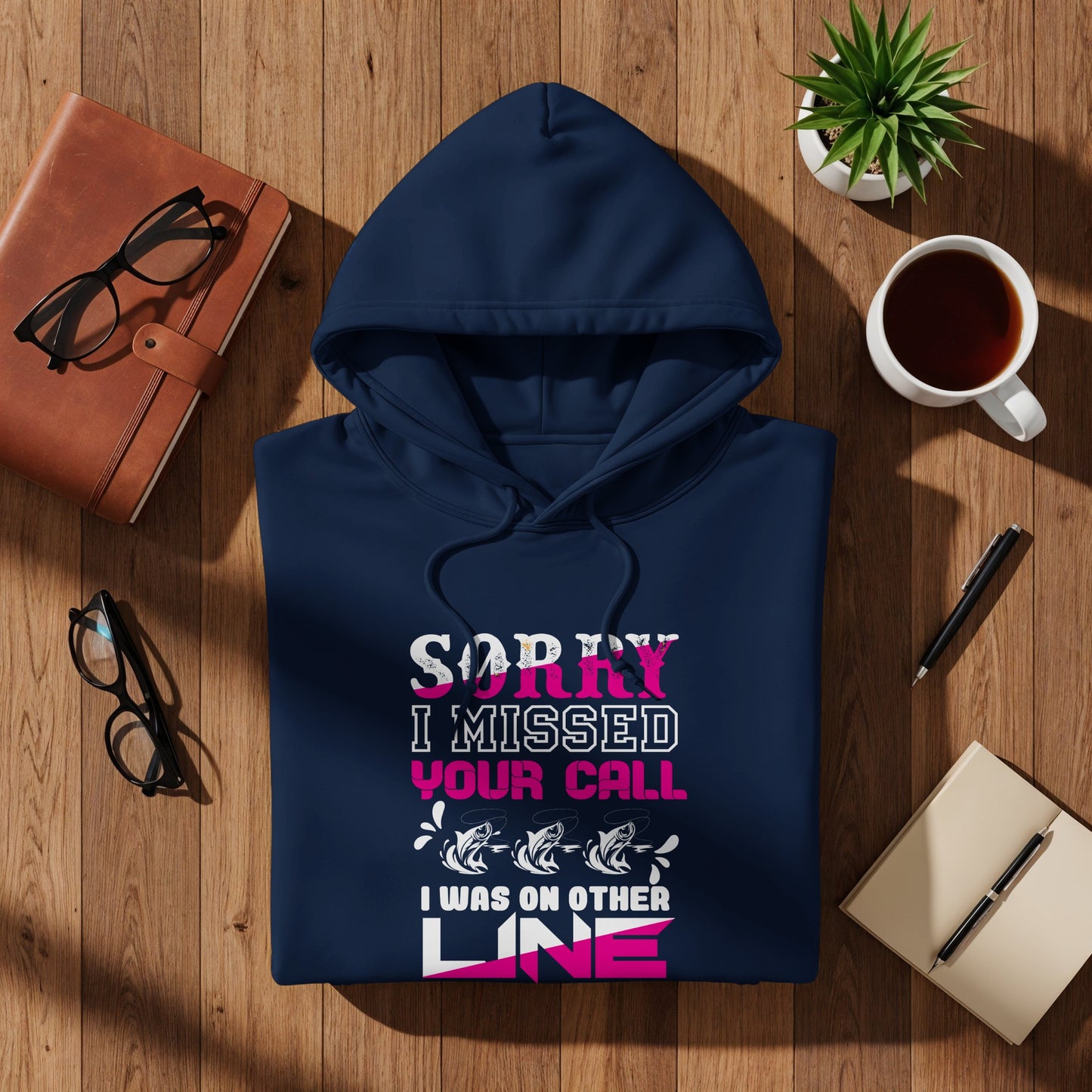 Navy hoodie with "Sorry I missed your call, I was on the other line" fishing graphic.