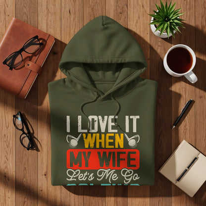 Green hoodie with text "I LOVE IT WHEN MY WIFE Lets Me Go".