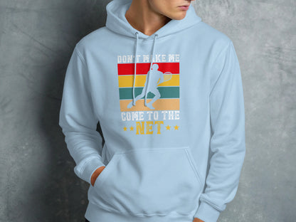 Light blue hoodie with a distressed tennis player graphic and text.