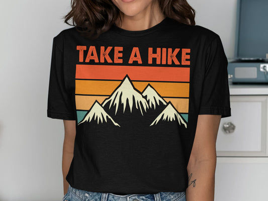Black t-shirt with mountain range silhouette and "TAKE A HIKE" text.